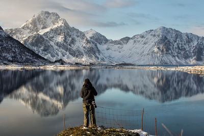 Panoramic view of lake and snowcapped mountains against sky