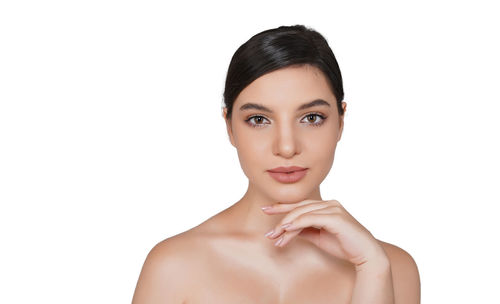 Portrait of a beautiful young woman over white background