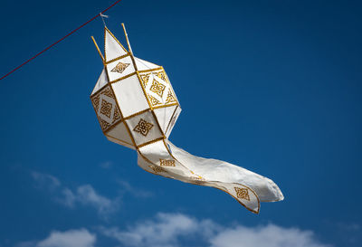 Low angle view of paper lantern hanging against clear sky