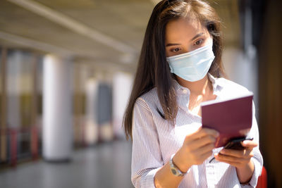 Portrait of woman using mobile phone