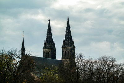 Low angle view of building against cloudy sky