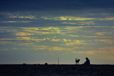 Silhouette people at sunset