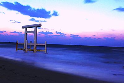 Lifeguard hut in sea against sky