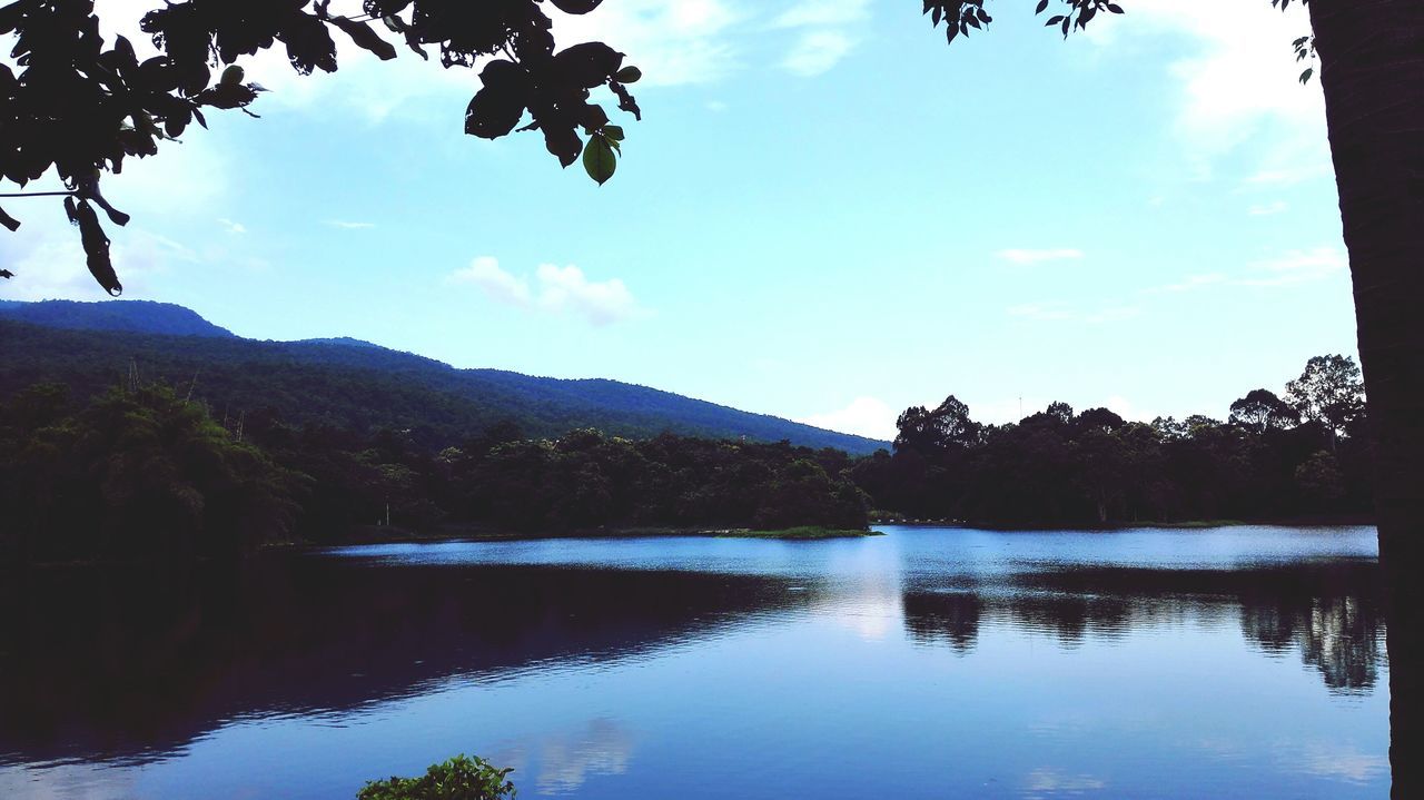 water, tranquil scene, reflection, mountain, lake, tranquility, sky, scenics, tree, beauty in nature, mountain range, nature, waterfront, cloud - sky, cloud, idyllic, calm, non-urban scene, blue, standing water