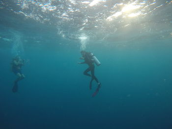 People swimming in sea