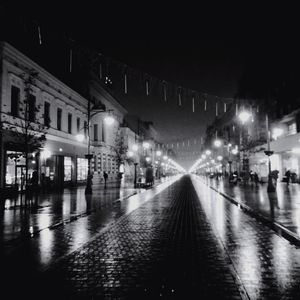 Illuminated street lights at night