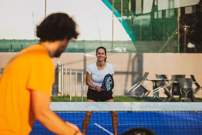 Tennis players playing at court