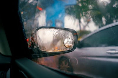 Close-up of raindrops on car window