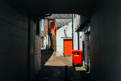 Back alley with red door in medieval town of ambleside, lake district, england.