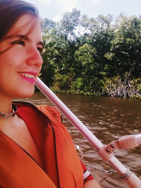 Close-up of young woman in water