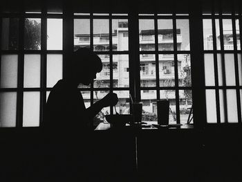 Woman having breakfast at home