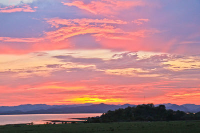 Scenic view of silhouette landscape against romantic sky at sunset