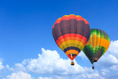 Low angle view of hot air balloon against blue sky