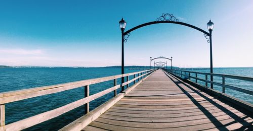 Pier over sea against sky