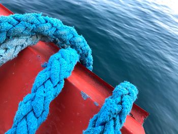 High angle view of rope tied on pier