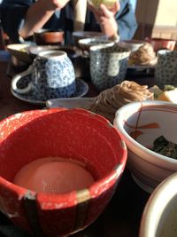 Midsection of people at market stall