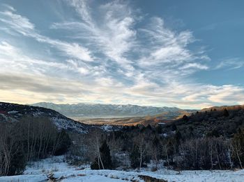 Scenic view of snowcapped mountains against sky during winter