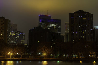 Illuminated buildings in city at night