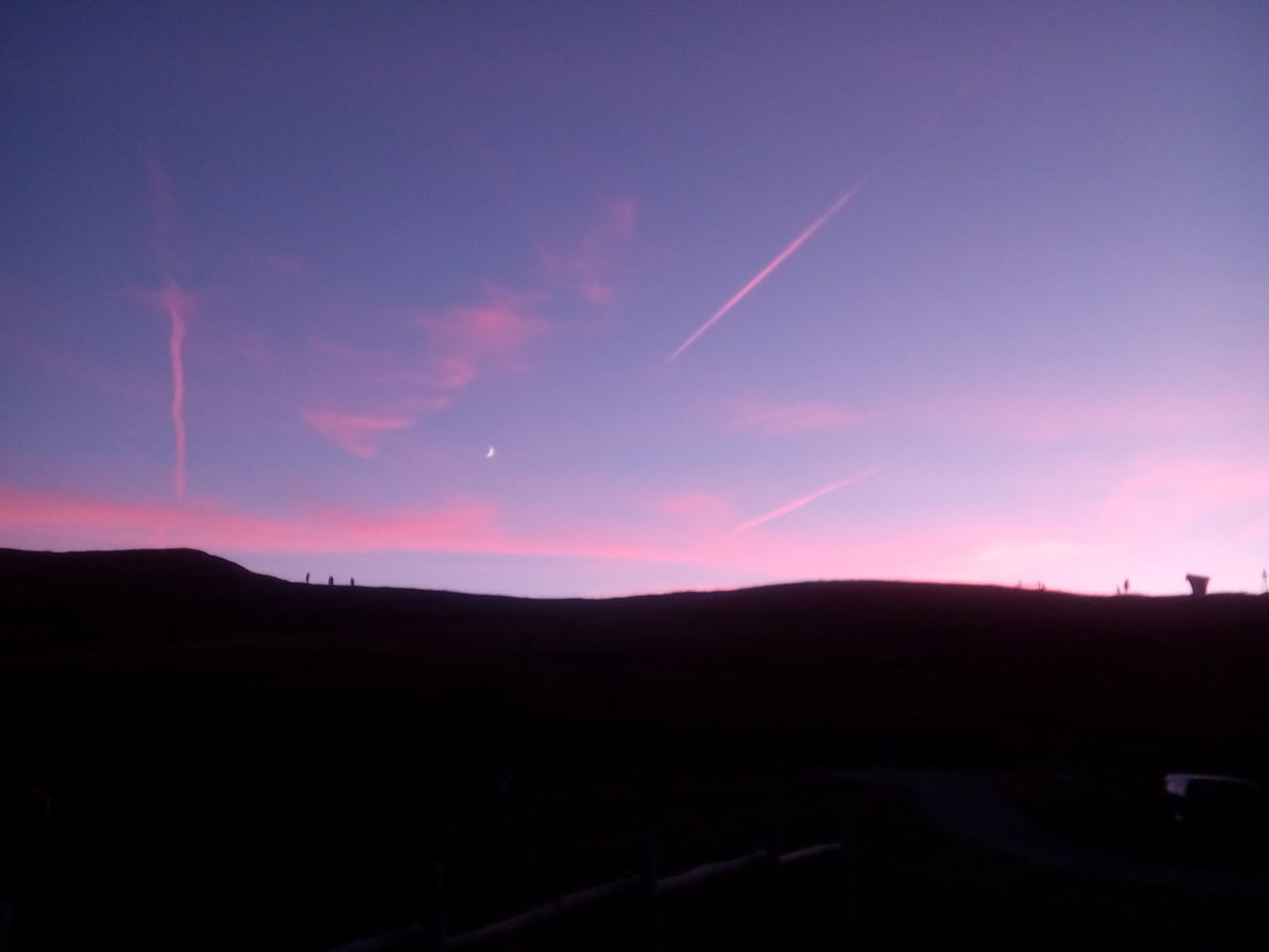 silhouette, landscape, tranquil scene, tranquility, outline, scenics, sunset, calm, sky, dark, vapor trail, horizon over land, non-urban scene, nature, beauty in nature, cloud, majestic, outdoors, blue, mountain, moody sky, non urban scene, no people, remote