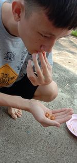 High angle view of boy looking at camera