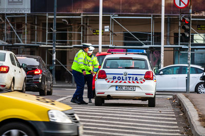 Man standing on street in city