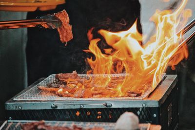 Close-up of meat on barbecue grill