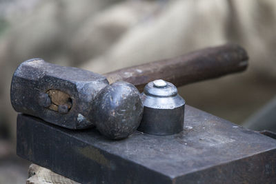 Close-up of hammer on metal