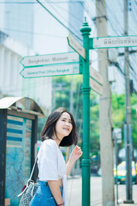 Smiling woman standing in city