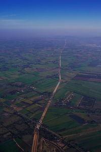 Aerial view of agricultural field against sky