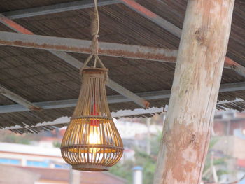 Low angle view of illuminated light bulbs hanging from roof