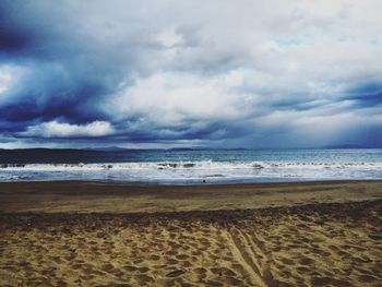 Scenic view of sea against cloudy sky