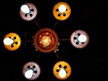 Low angle view of illuminated lights hanging from ceiling