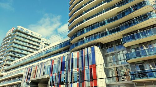 Low angle view of buildings in city against sky