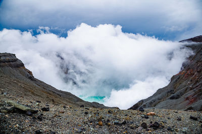 Heavy smoke comes from an active volcano crater in kyushu, japan