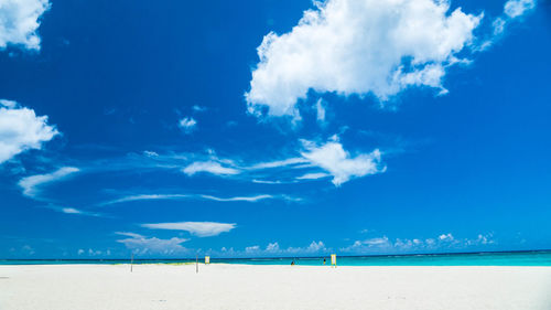 Panoramic view of beach against blue sky