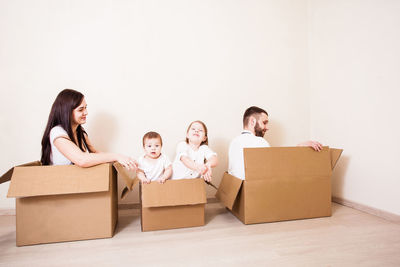 Rear view of father and son in box