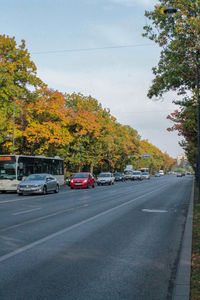 Cars on road against sky