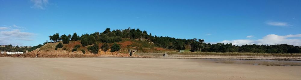 Scenic view of landscape against blue sky