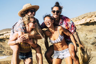 Cheerful friends enjoying on beach