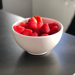 High angle view of strawberries in bowl on table