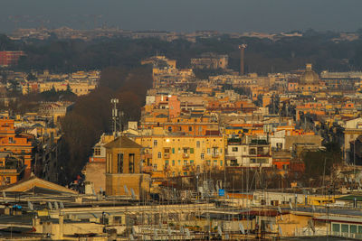 Panorama on the city of rome, prati district, mist on the horizon.