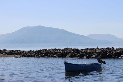 Scenic view of lake with mountains in background