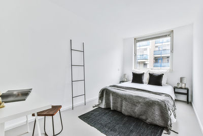 Empty chairs and table against wall at home