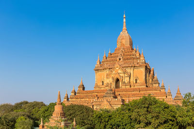 View of temple against clear blue sky