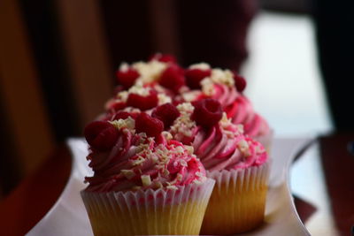 Close-up of cupcakes on cake