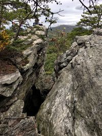 Close-up of rocks on mountain against sky