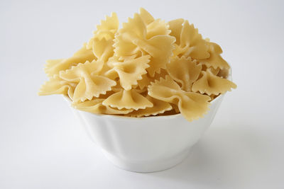 Close-up of ravioli in bowl against white background