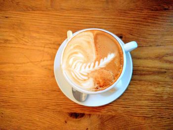 High angle view of cappuccino on table