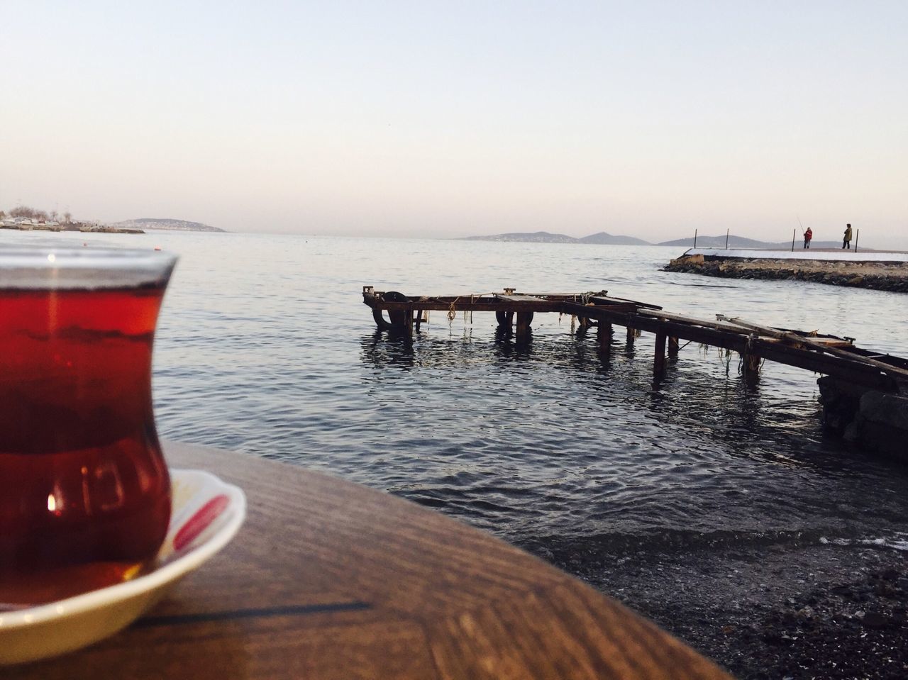 water, sea, clear sky, horizon over water, copy space, nautical vessel, tranquil scene, table, boat, transportation, scenics, tranquility, beach, sky, pier, mode of transport, nature, food and drink, moored, beauty in nature