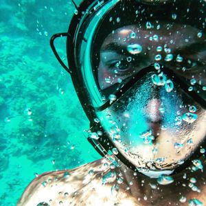 Close-up of person swimming in sea